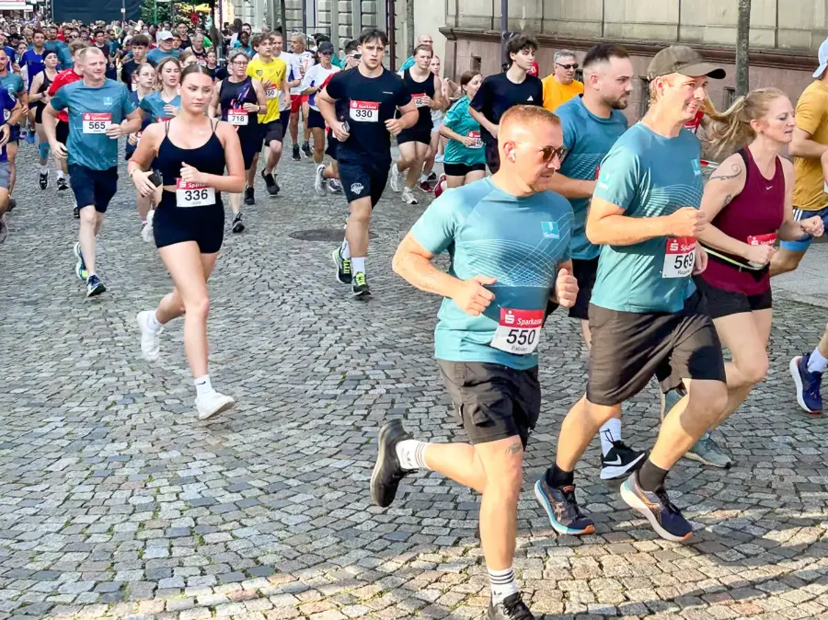 Participants running through the historic town center during the Emmendingen City Run 2024.