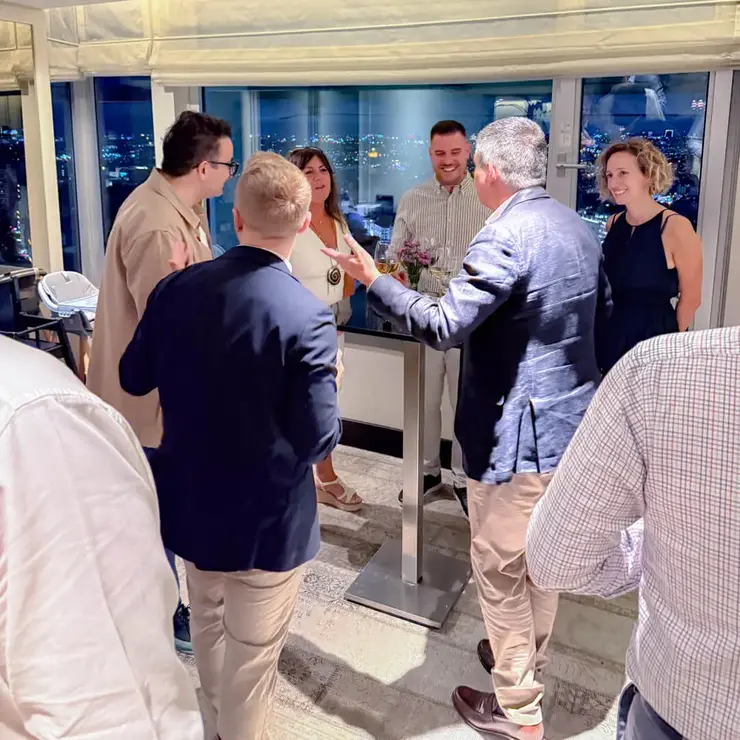 Participants networking during the Sutter Distributor Conference 2026 in Istanbul with a nighttime city view.