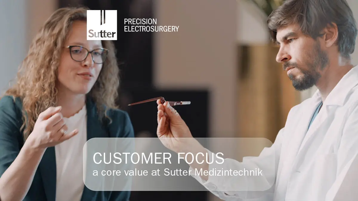 customer-focus-core-value-sutter-medizintechnik.jpg Two people in discussion, focus on precision instrument, Customer Focus at Sutter Medizintechnik