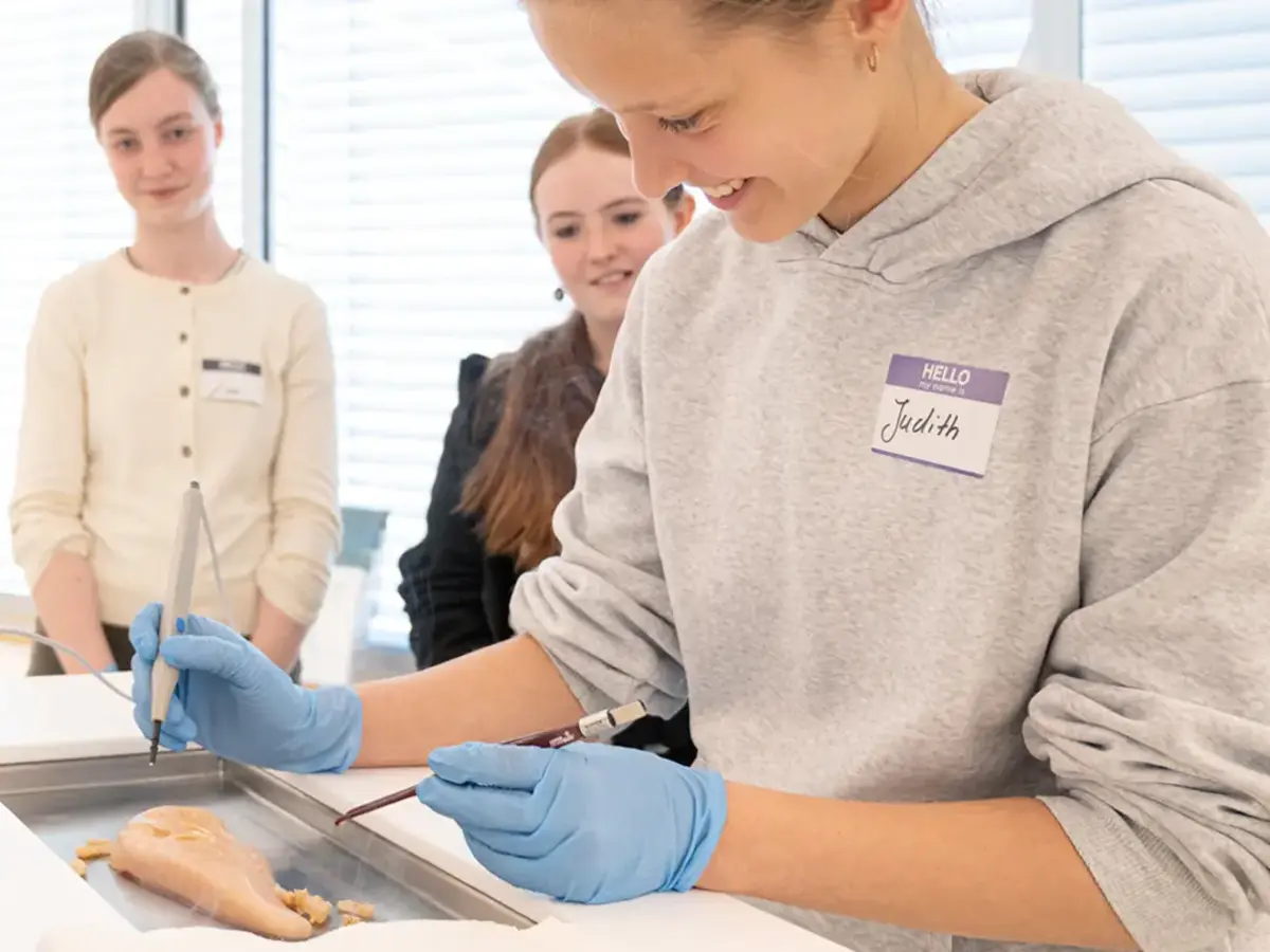 Career exploration in healthcare: participants gain practical experience using medical surgical instruments.