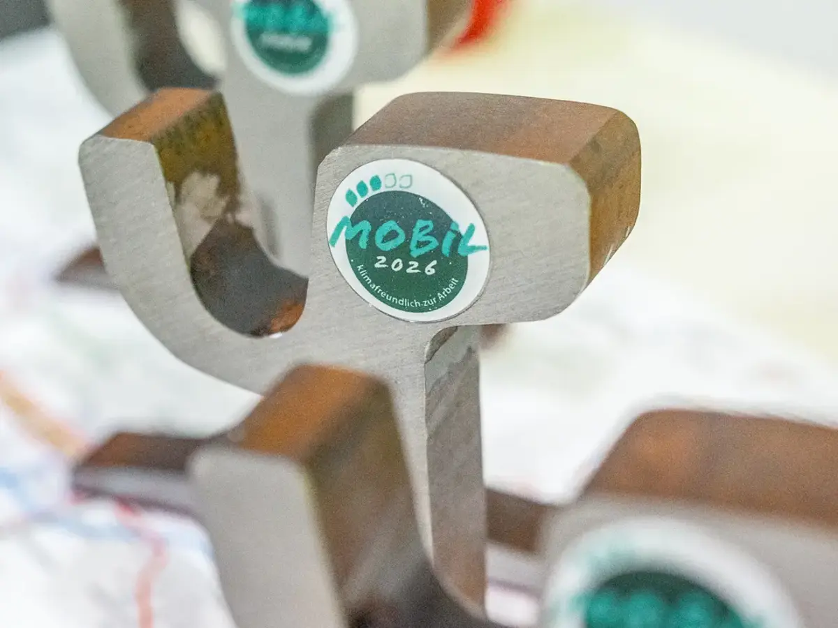 Trophy made from recycled tram steel components with Mobil 2026 seal.