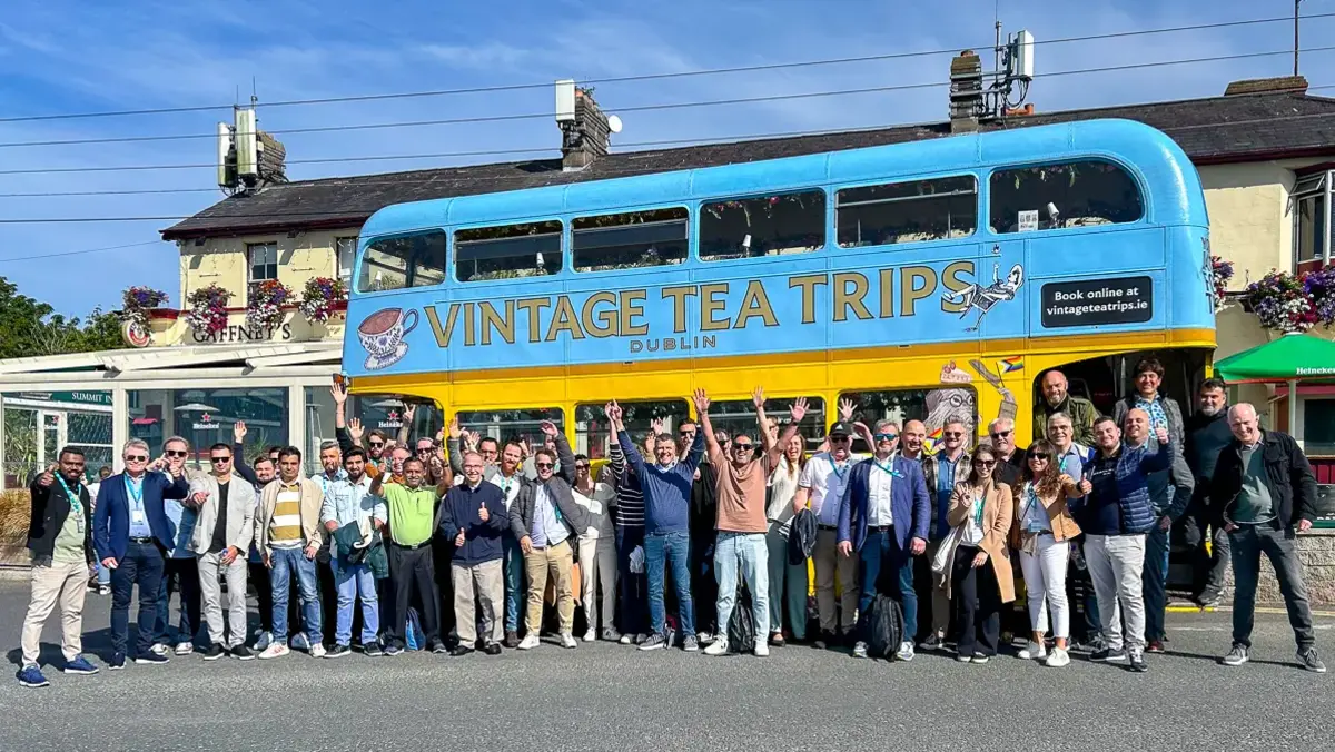 SDC 2024 participants posing in front of a bus in Dublin.