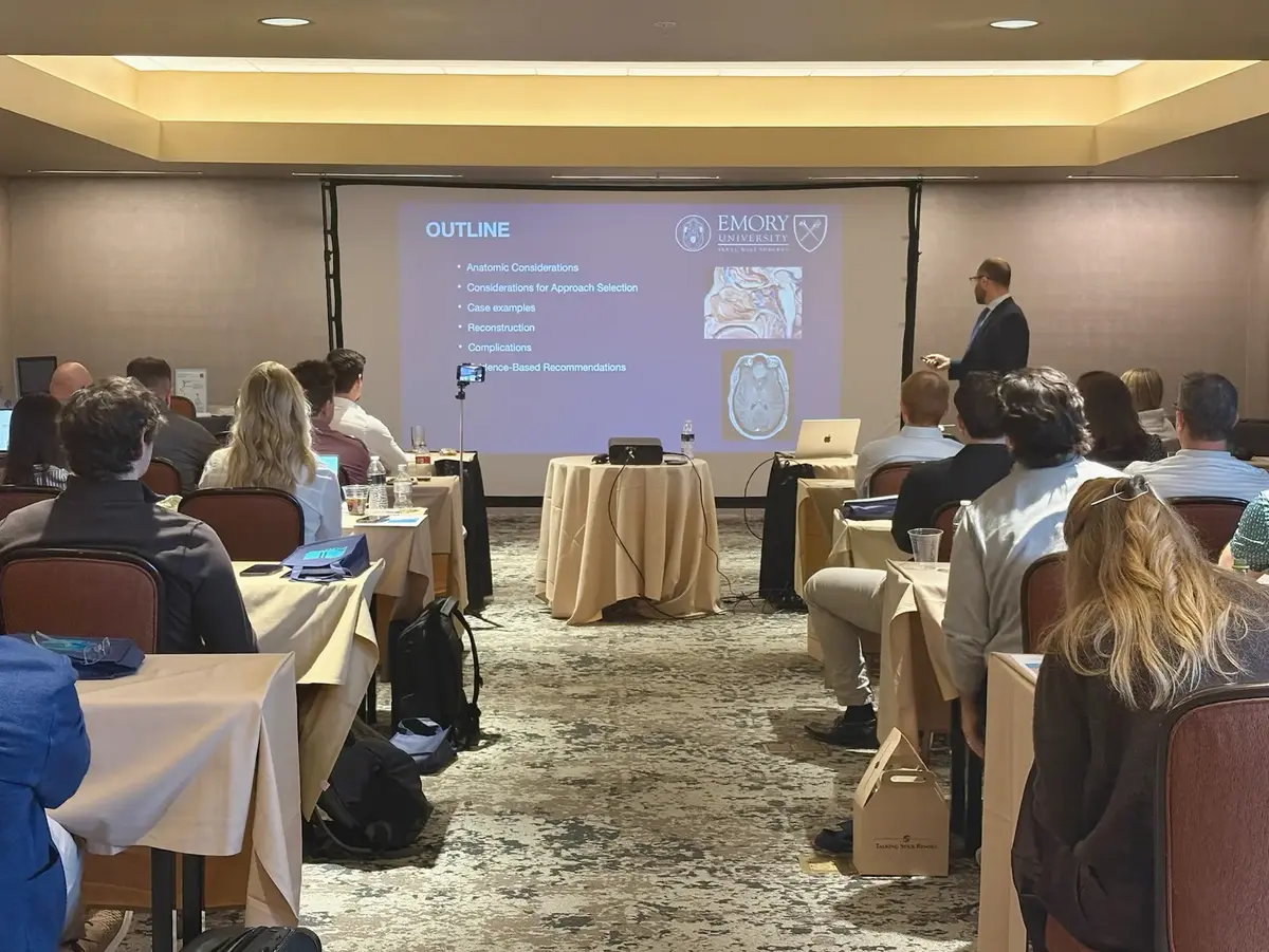 Attendees listen to an expert presentation in a conference setting. The event highlights professional learning, knowledge sharing, and industry networking.